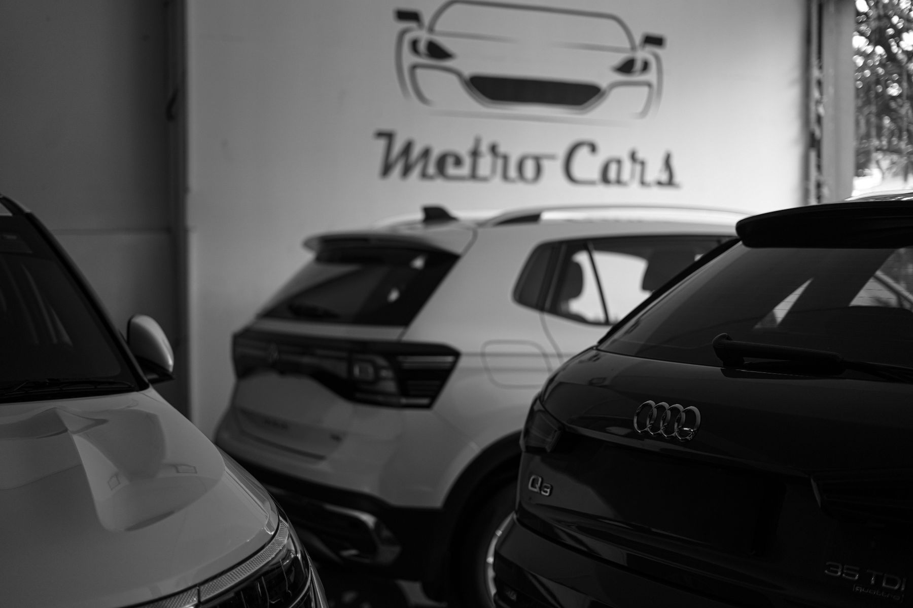 Inside the Metro Cars showroom — Audi Q3, Volkswagen Taigun on the floor